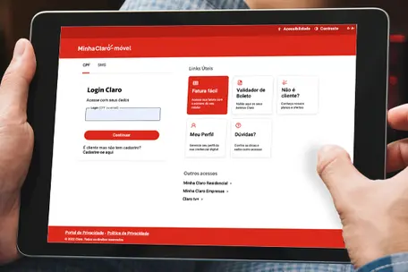 Imagem de tablet com a página do site Minha Claro residencial.