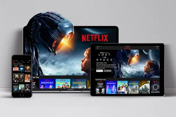 Imagens do Netflix com filmes e séries distribuídas em dispositivos: computador, tablet e celular.